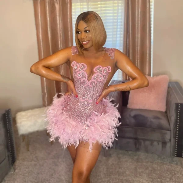 Pink homecoming dress with feathers, crystals for Black girls' party